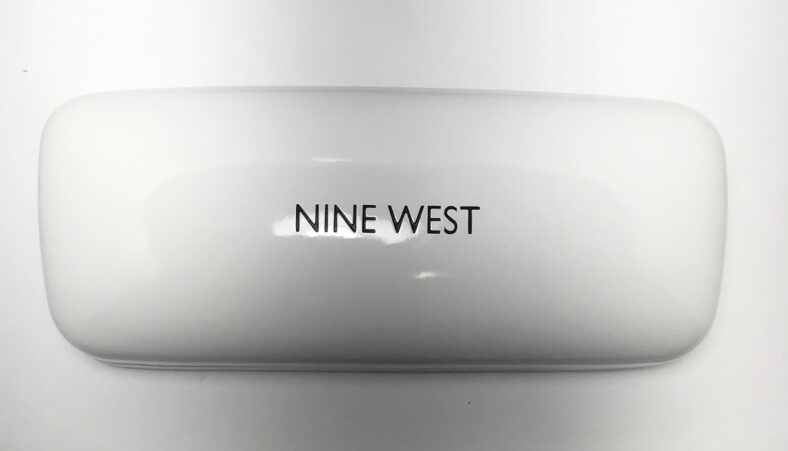 White Nine West eyeglasses case.