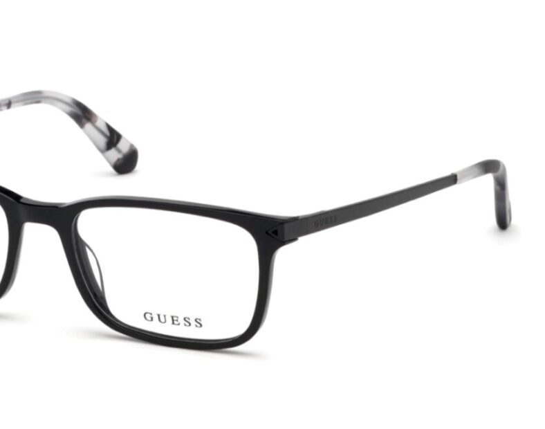 Black Guess eyeglasses, rectangular frame.