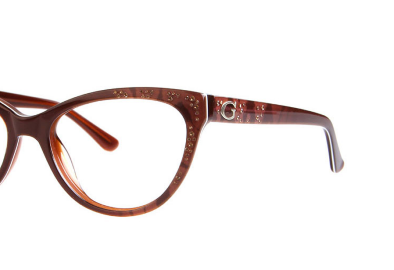 Brown cat-eye glasses with glitter.