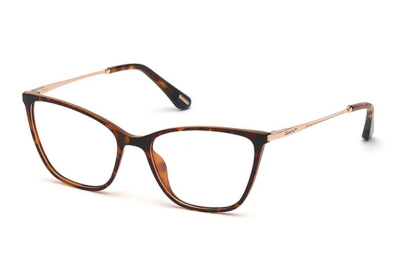 Brown tortoise eyeglasses with rose gold accents.